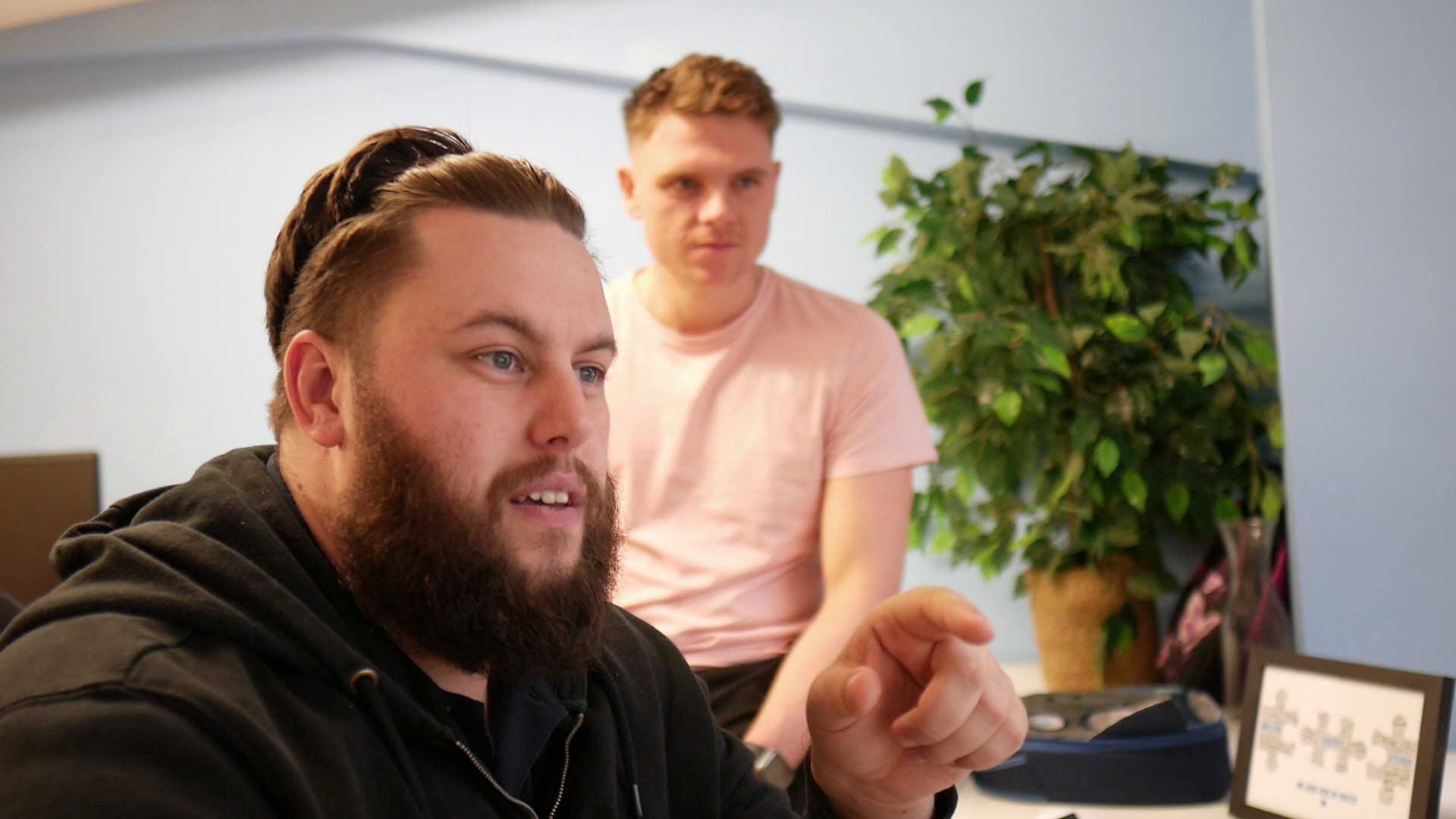 meeting between two people at a desk