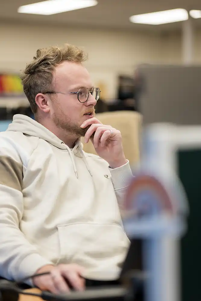 Team member working on a computer