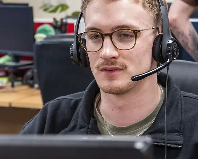 man on headset in office