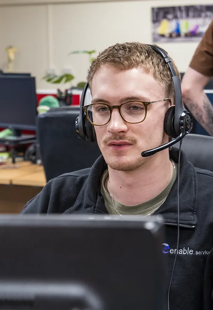 man on headset in office