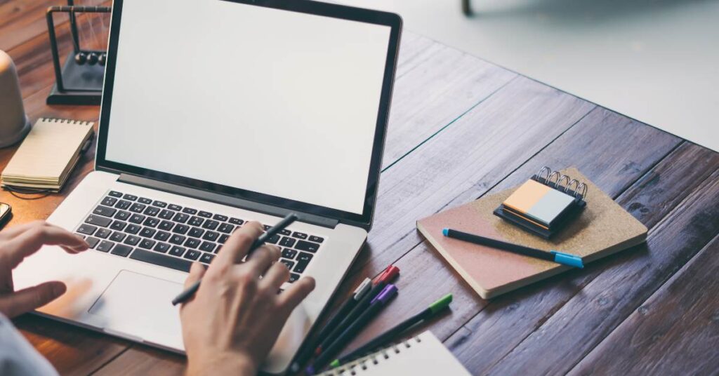 Computer on desk being used