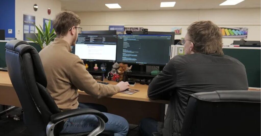 Man showing another man SugarCRM
