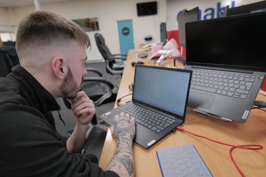 man working on a laptop in office