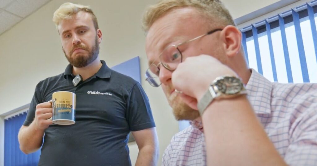 2 men looking at computer intuitively