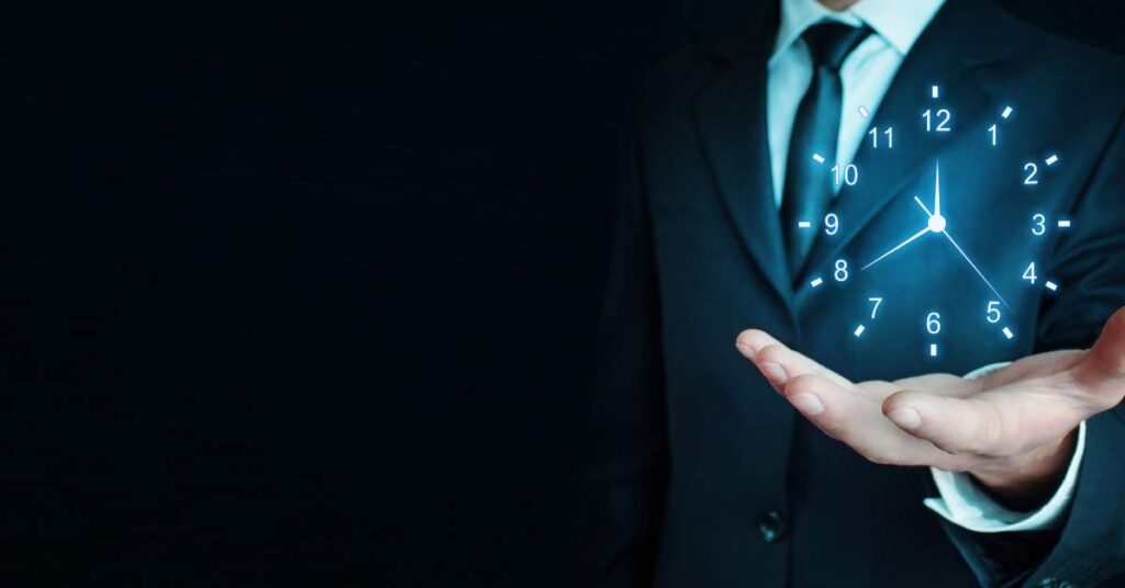 man's hand holding a graphic of a clock