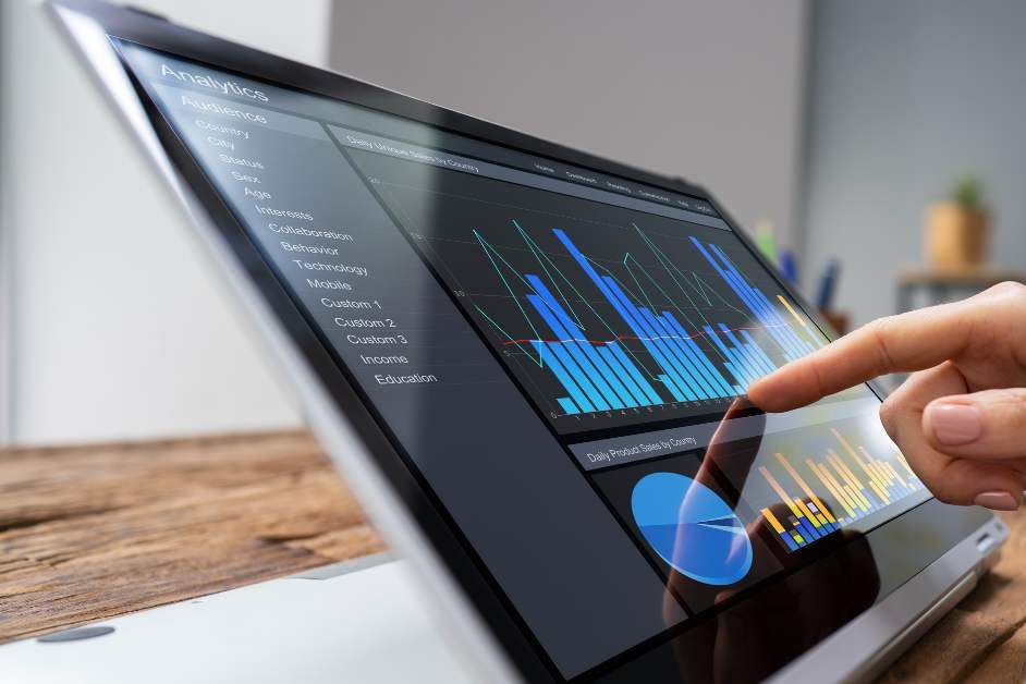 Hand using tablet pressing on chart