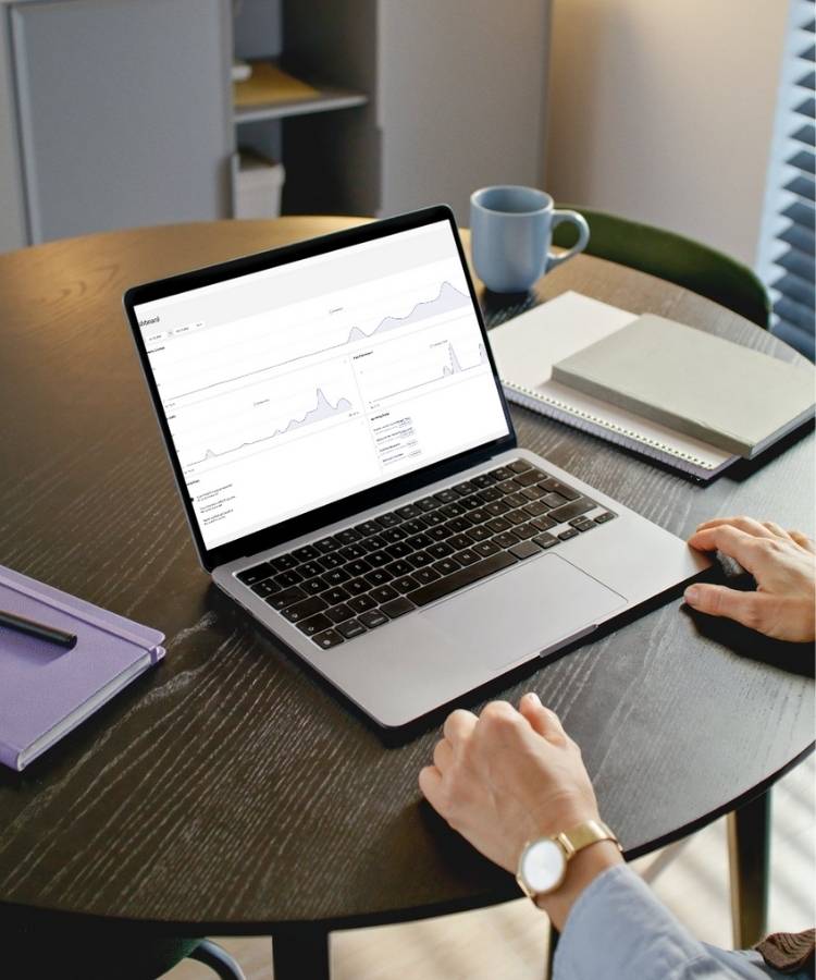 EspoCRM dashboard on laptop on table