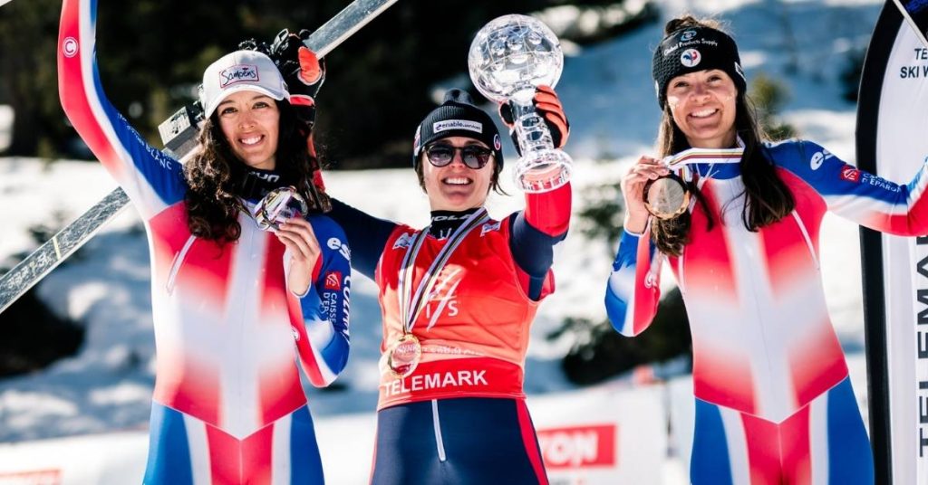 Jasmin taylor and other competitors at telemark skiing world cup holding up trophies and medals