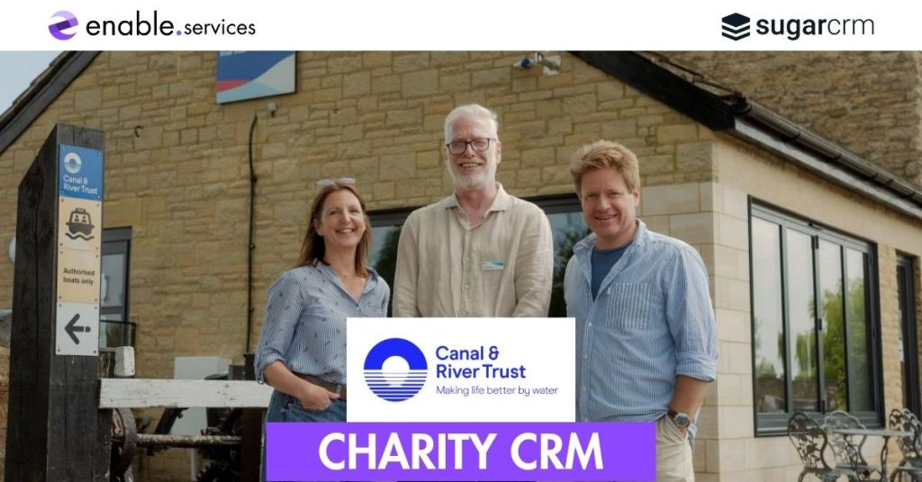 Three people smiling outside of crt office