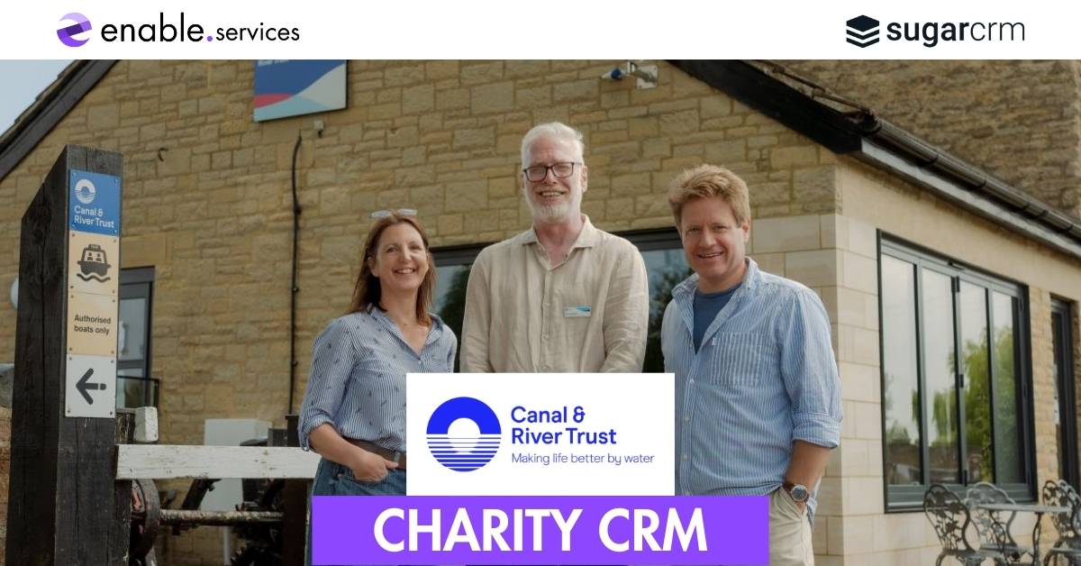 Three people smiling outside of crt office