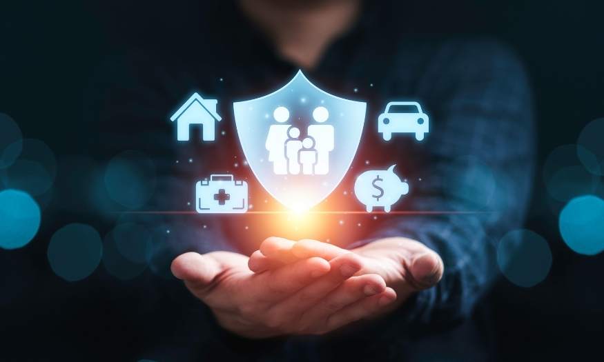 Man holding hand out with a graphic on top of a family, car, piggy bank, house and medical