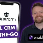 Graphic showing a large mobile phone with the SugarCRM logo and man next to it.