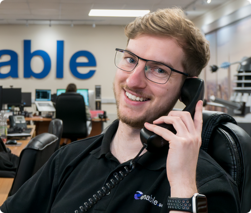 man smiling to camera on the phone
