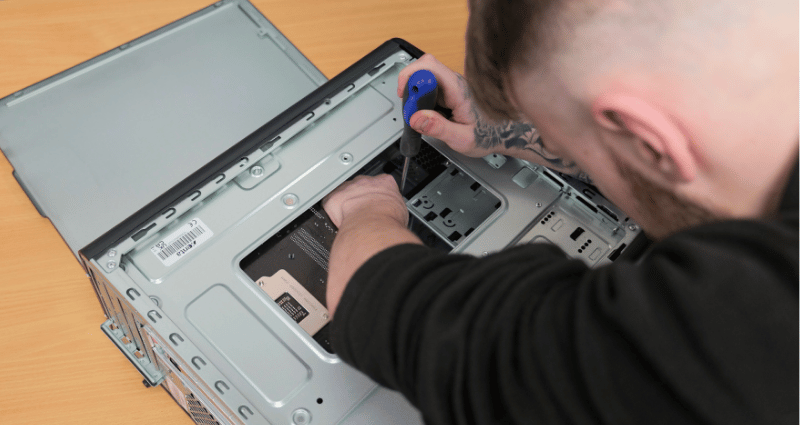 Man fixing a PC with tool