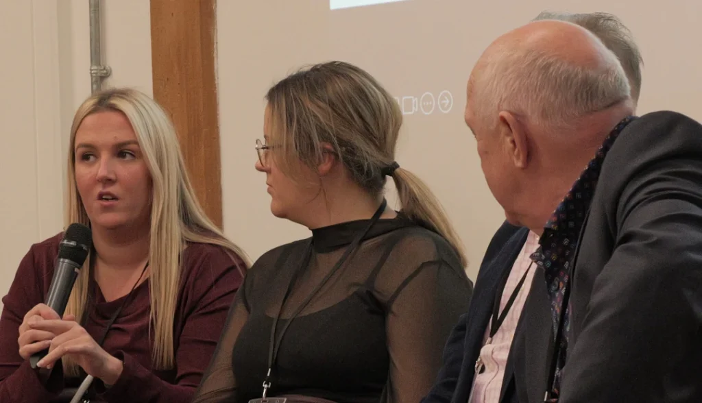 image of three people talking whilst sitting down