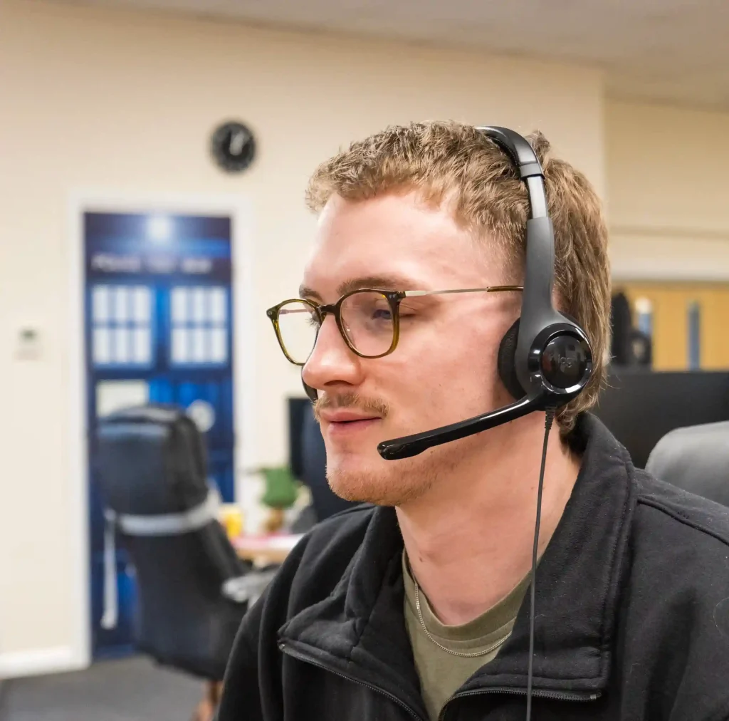 man using headset on computer