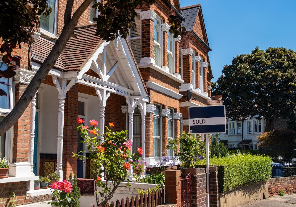 exterior of house with a sold sign outside
